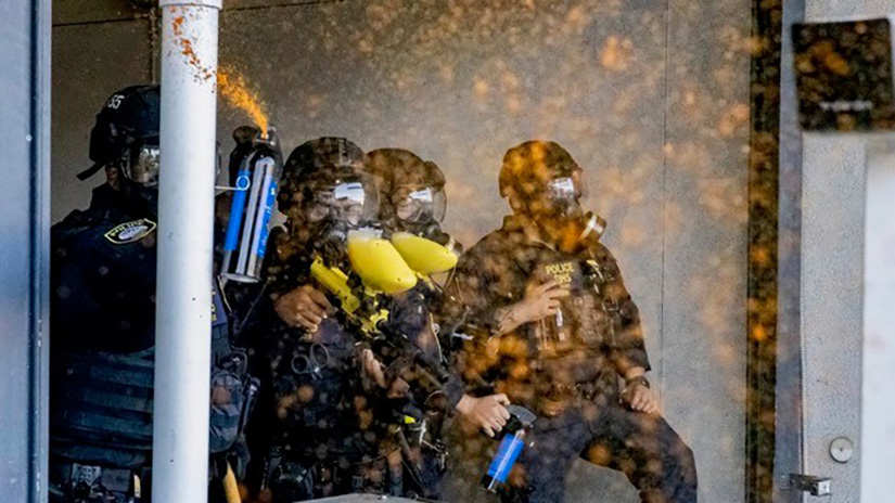 A photo taken by Jake Crandall of Department of Homeland Security Officers pepper-spraying him and other protestors during a protest at the Metropolitan Detention Center in Downtown Los Angeles, Calif., on July 6, 2025 in response to ICE raids across LA. The Journalism Association of Community Colleges (JACC) awarded Crandall of The Corsair first place in the Online Photo Story/Essay category. (Photo Credit: Jake Crandall / The Corsair)  