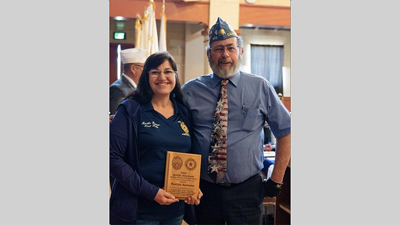 Martha Romano receiving the 2024 Dottie Sherrard Auxiliary Member of the Year award