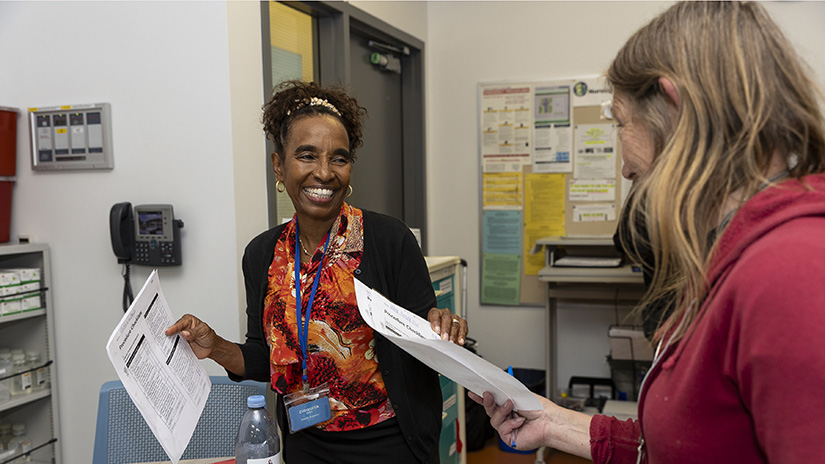 Dr. Chi collecting homework