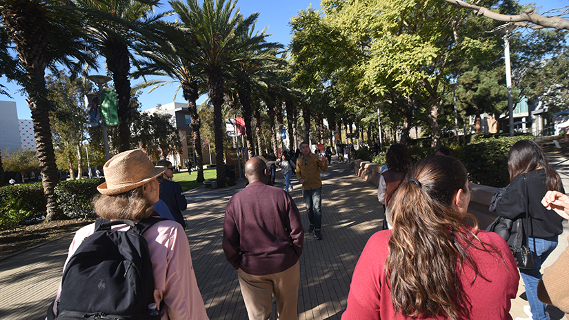 Students on a tour of recycling sites on campus