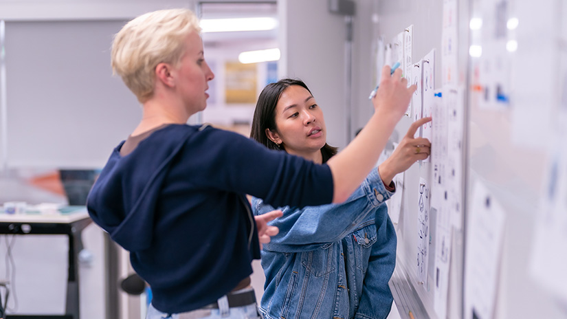 Discussions at the whiteboard in a study room