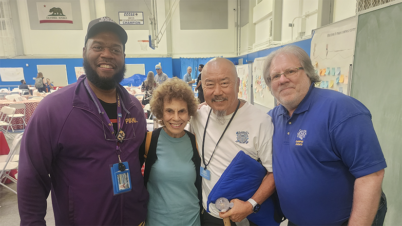 Terry with colleagues after receiving Manager of the Year award