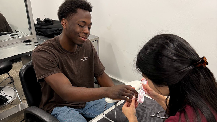 Cosmetology students helping MOCAN students destress from midterms
