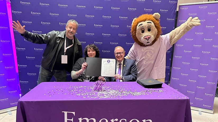 Signing ceremony at Emerson College with her dad and Emerson dean