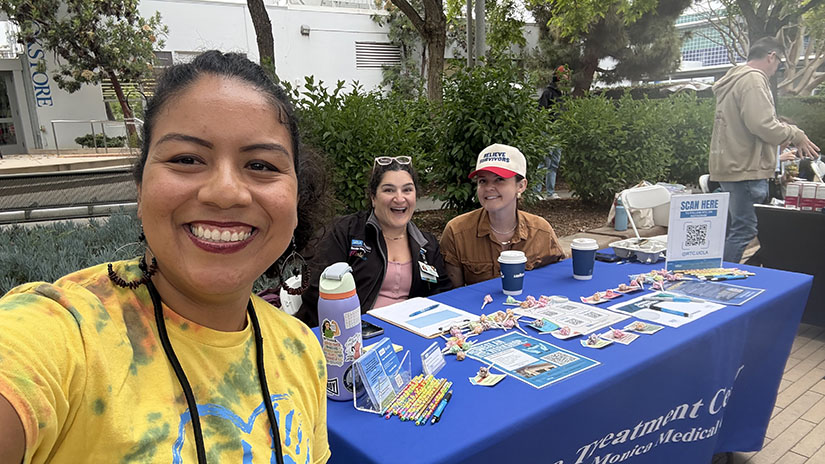 Julyssa at UCLA Rape Treatement Center table at the resource fair