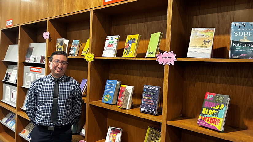 Walter at the "new books" shelf at the SMC Library