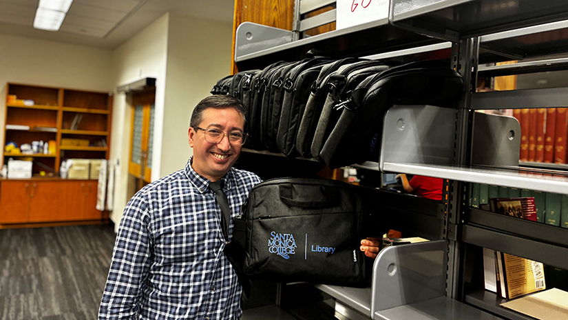 Walter with loaner Chromebooks at the SMC Library
