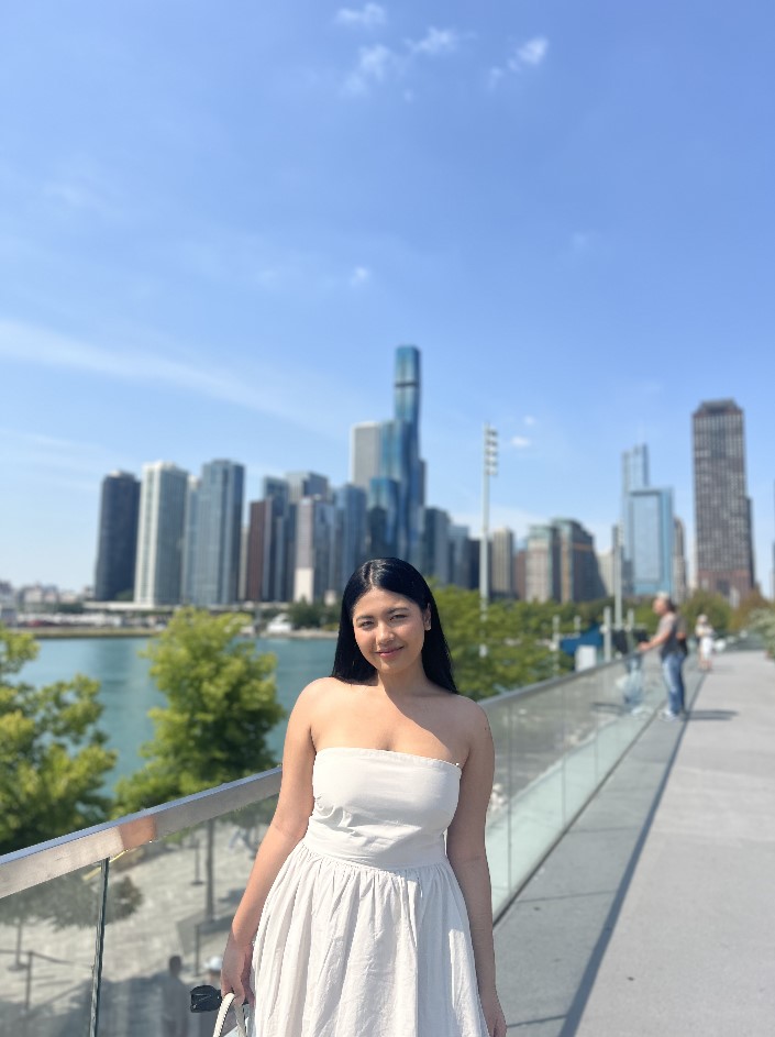 Student in front of buildings